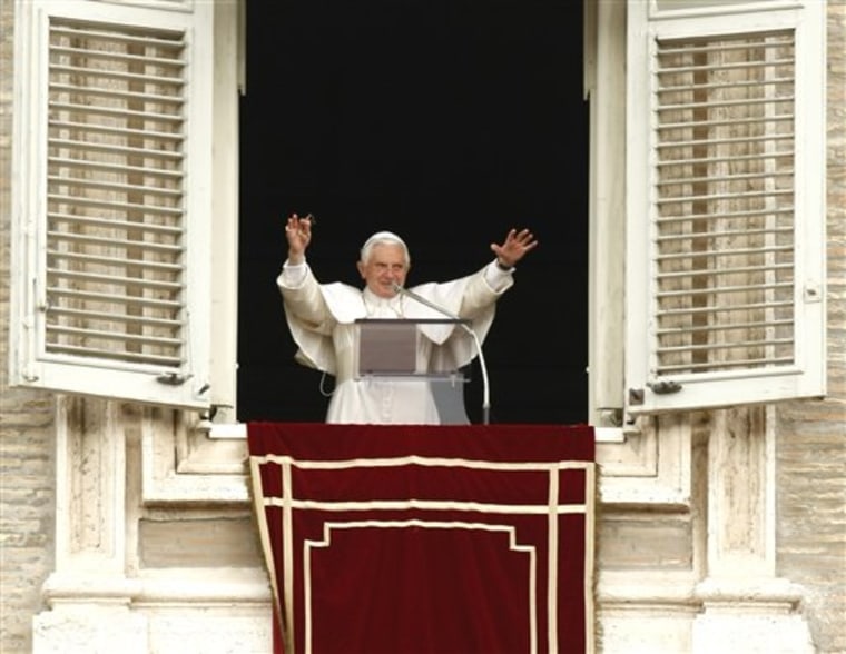 Pope Benedict XVI blesses faithful from the window of his studio overlooking St. Peter's Square at the Vatican on Sunday. More than 100,000 supporters filled the square.